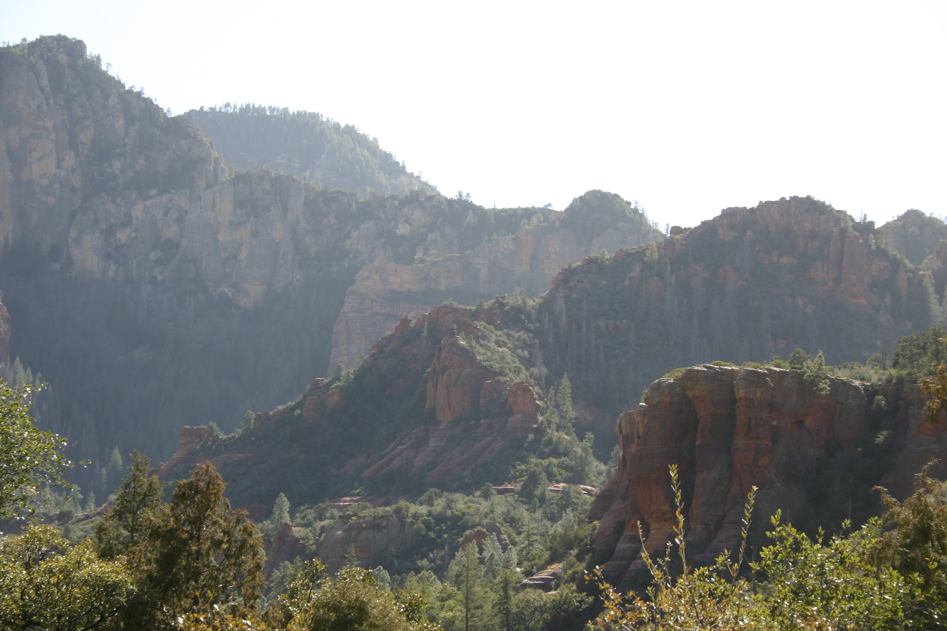 Red rock mountains fade progressively into the distance in Sedona. 