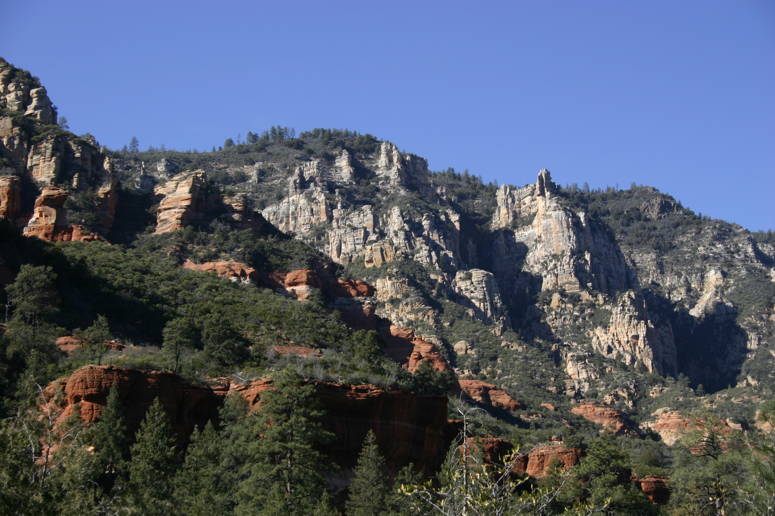 Red and gray rock cliffs and towers in Sedona. 