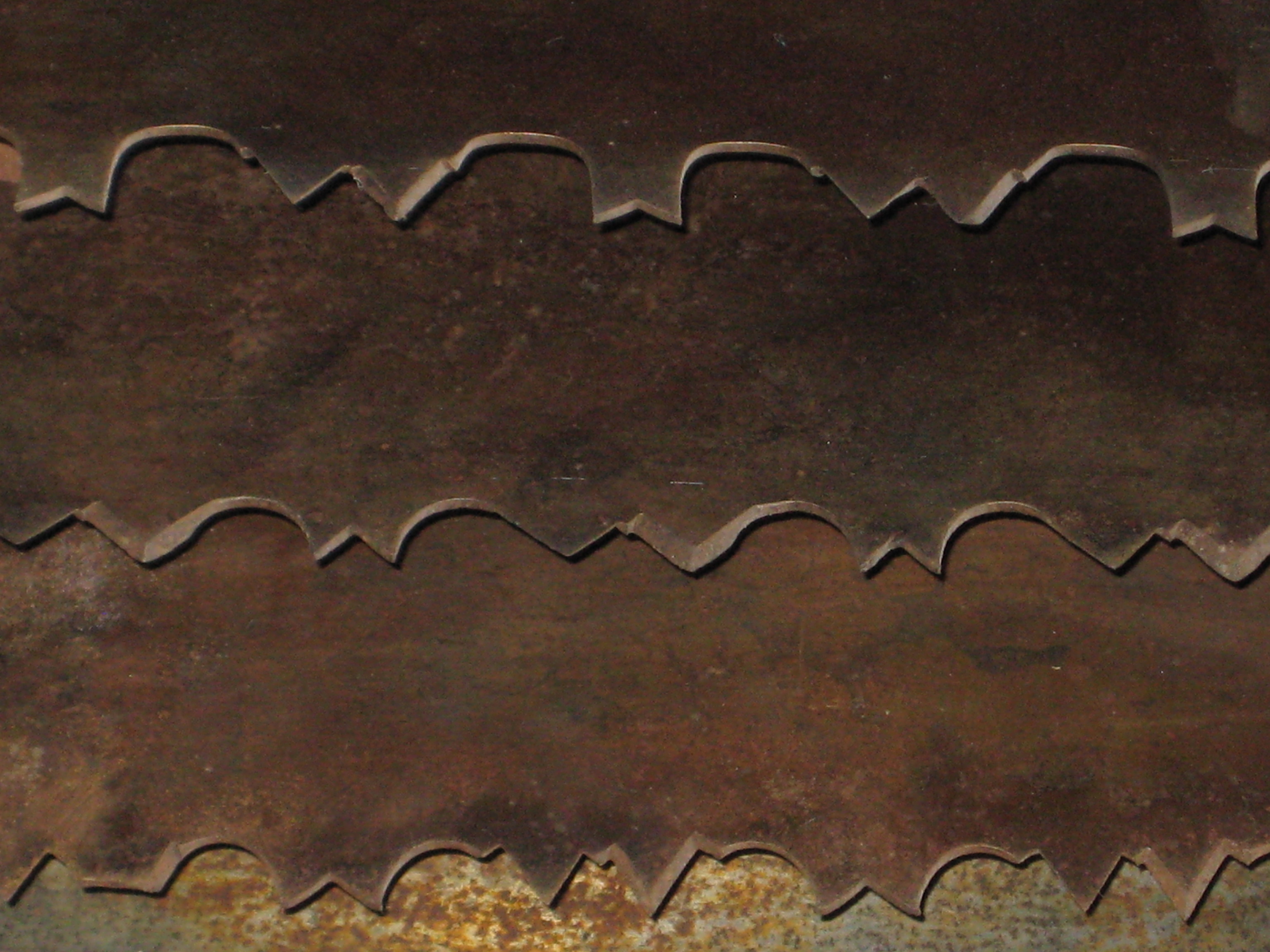 Overlapping rusty saw blades. 