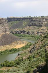 Snake River Canyon in Twin Falls, Idaho. You can see a waterfall in the distance on the right. 